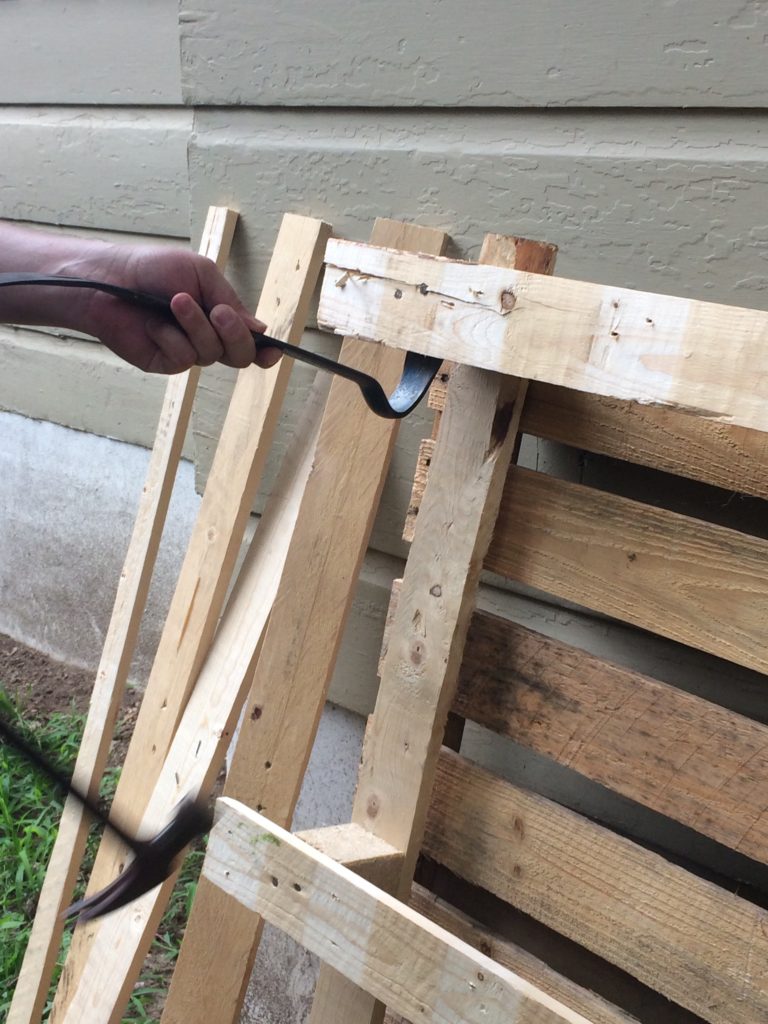 Pulling apart pallets for wood