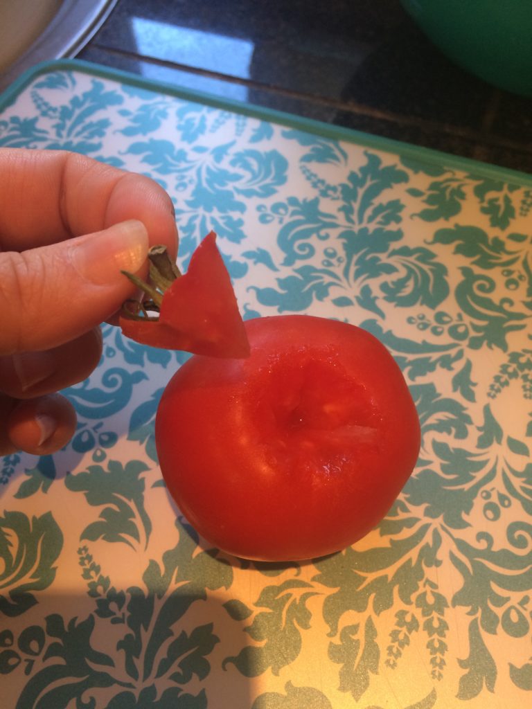 Removing the stem from tomatoes